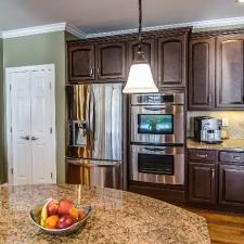 Kitchen cabinet refinishing to a rich furniture finish